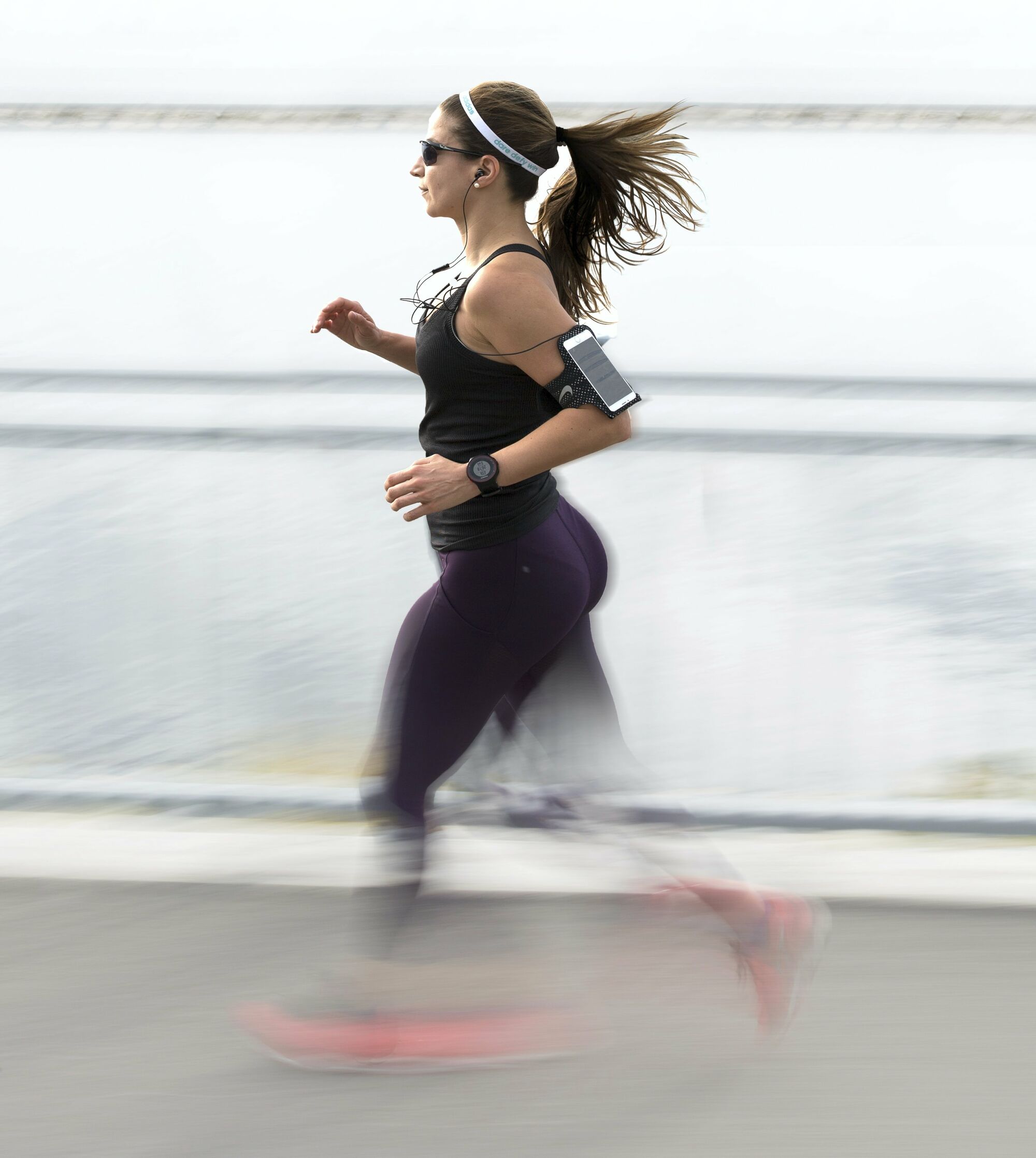 A runner wearing a gps device