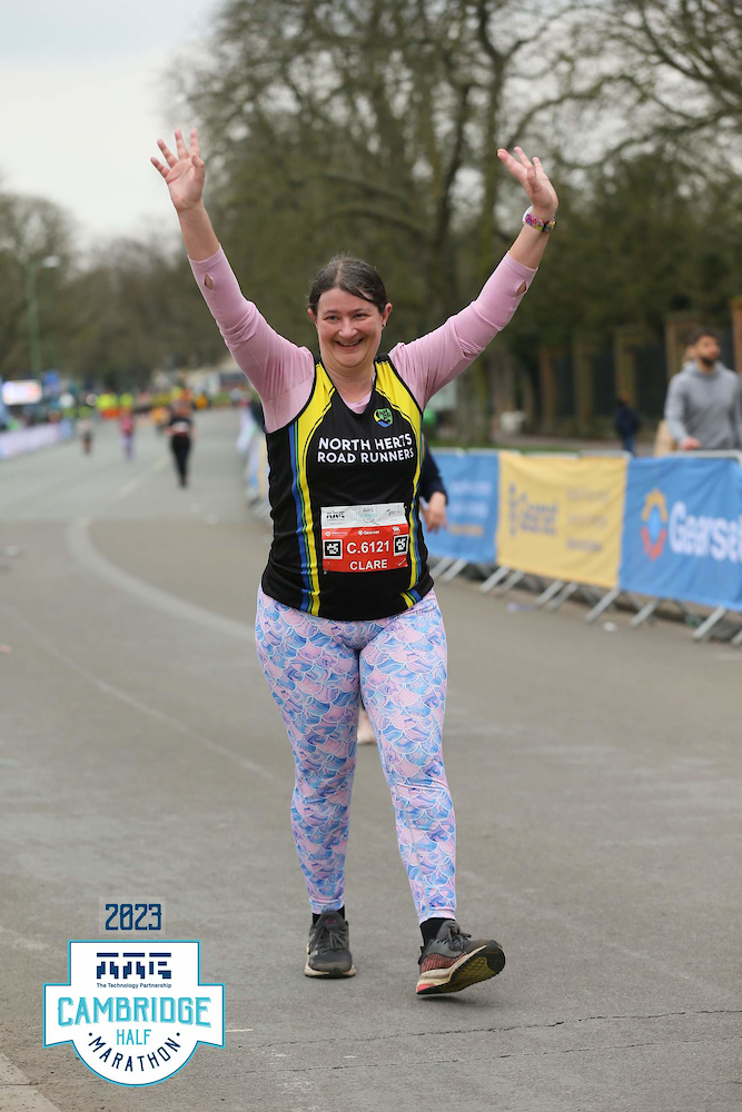 Me with my hands in the air walking down the finishing straight